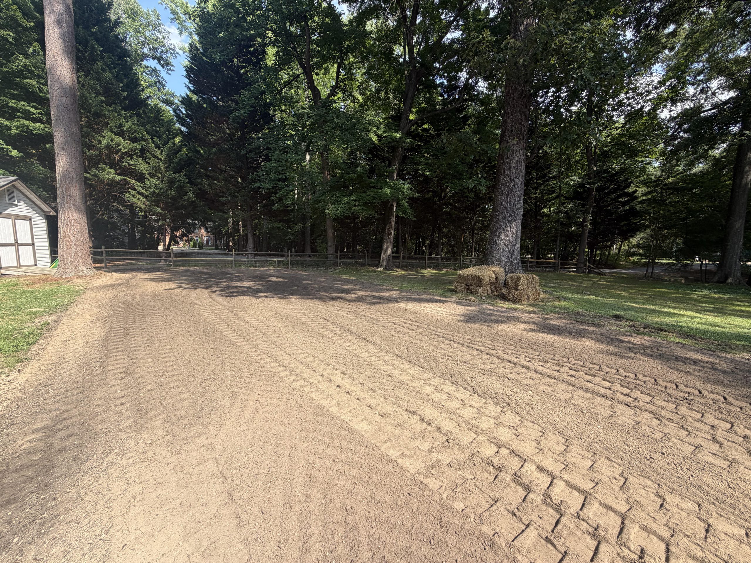 Freshly graded dirt lot with compacted soil surface, Sturtz Contracting grading services